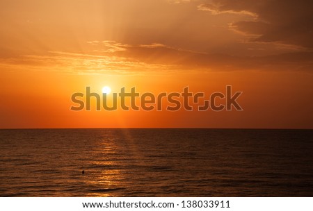 Sunrise with Early Bird over the Mediterranean sea.
