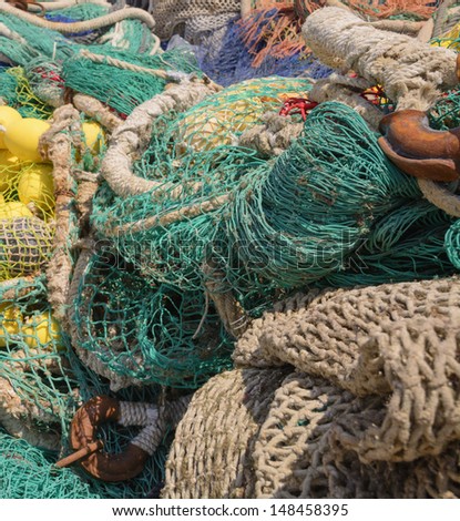 Colorful fishing nets with knots and nets closeup.