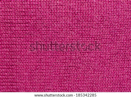 Pink fuchsia knit work. Pink fuchsia wool knit work full frame for warming backdrop or background.