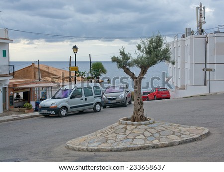 SANT ELM, MAJORCA, SPAIN - OCTOBER 30 2013: Small roundabout with tree and ocean view on October 30 2013 in Sant Elm, San Telmo, Mallorca, Balearic islands, Spain.