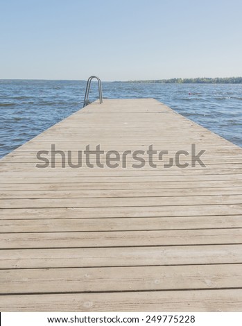 Jetty stretch. Wooden jetty by lake Malaren, Stockholm, Sweden in May.