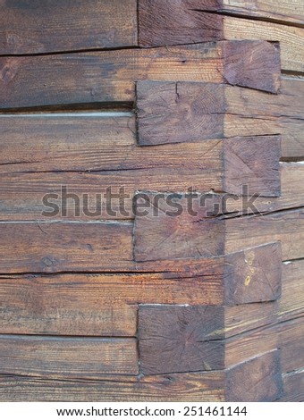 Knotted timber corner on a log house, detail.