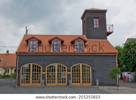 AHUS, SOUTH SWEDEN - JUNE 28, 2014: Old fire station building in special design with tower on June 28, 2014 in Ahus, South Sweden.