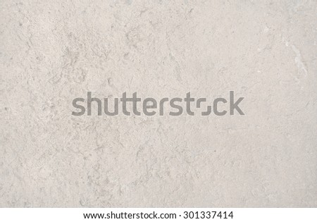 Cream color distressed vintage grungy roughcast or stucco wall for background texture or copy space in horizontal format in Mallorca, Balearic islands, Spain.