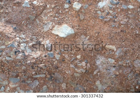 Red breccia or rough cast wall for background texture or copy space in horizontal format in Mallorca, Balearic islands, Spain.