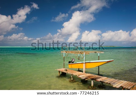 Yellow boat and turquoise water of Pacific, Maupiti, French Polynesia, Society Islands