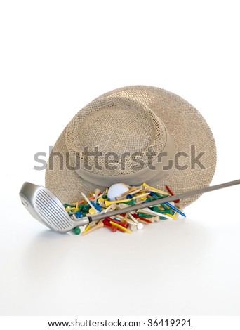 A straw hat for sun coverage, colorful golf tees , a driver and a ball isolated over a white background.