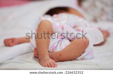 Newborn baby girl feet. A closeup with a candid appeal. The baby skin is caucasian tone.