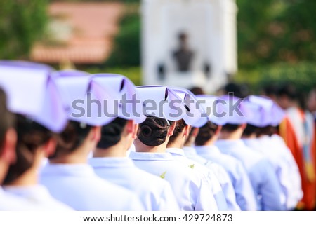 Crowd image of students nurse at graduation ceremony from behind