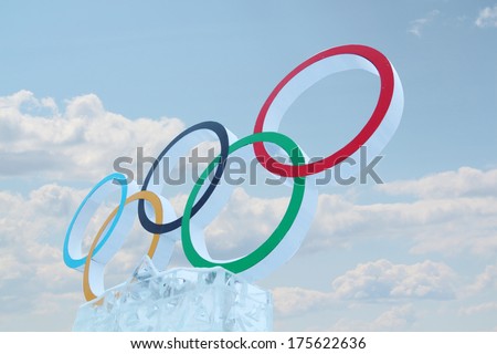PERM RUSSIA JAN 6 2014 Cloudy sky and symbol of Olympic Games in Ice town created in honor of Winter Olympic Games 2014 will be in Sochi Russia PERM RUSSIA JAN 6 2014 Cloudy sky and symbol of Olympic Games in Ice town created in honor of Winter Olympic Games 2014 will be in Sochi Russia