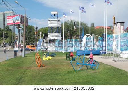 PERM, RUSSIA - JUN 11, 2013: Collection of colored decorative metal bike at entrance to town of White Nights in Perm