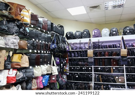 Shop with shelves with many various fashionable men and woman bags and backpacks
