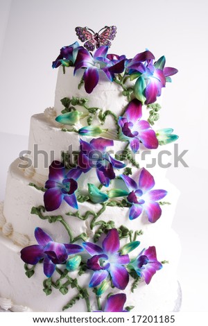 Four tier wedding cake with purple flowers