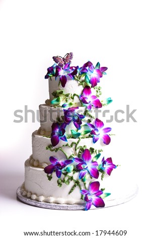 stock photo Four tier wedding cake with purple flowers