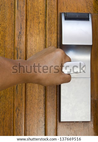 Hand opening the door in hotel.