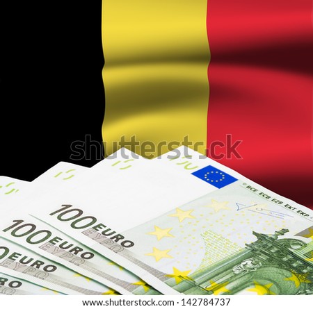 One hundred euro bills against belgian flag
