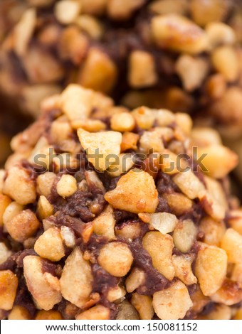 Chocolate truffle with nuts topping, macro shot