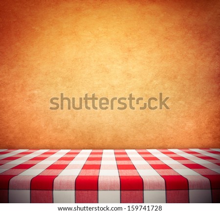 Red Checkered Tablecloth On Textured Wall