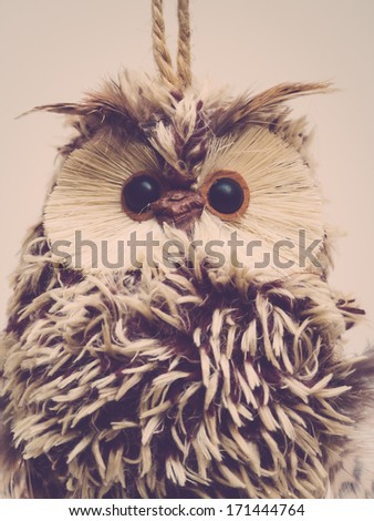 Owl ornament closeup, vintage toned image