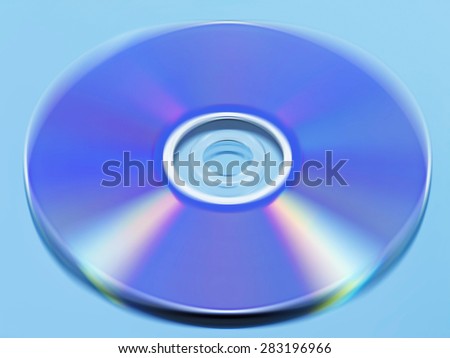 Spinning disc with motion blur on reflective surface