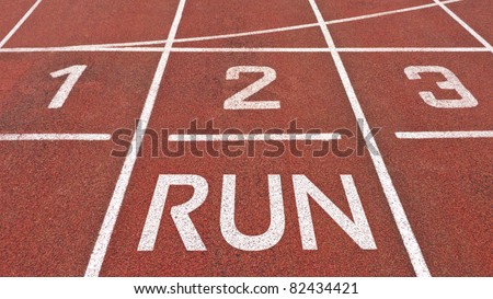 Start to run concept with word on running track
