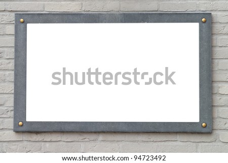 Blank stone plate on brick wall