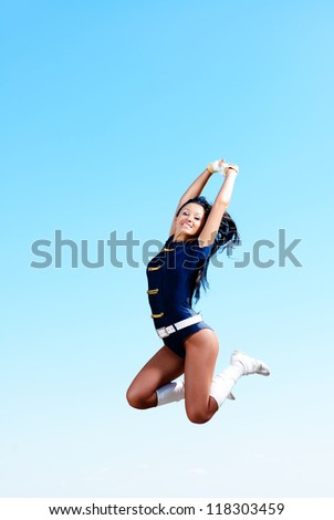 dancer jumping on a background of blue sky