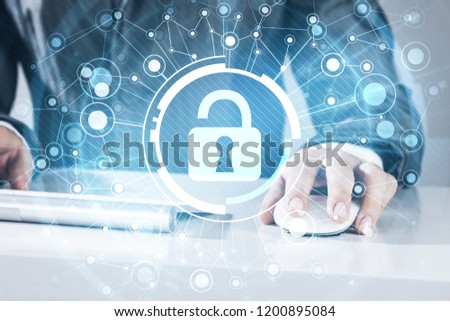 Close up of female hands using computer keyboard and lock icon on screen