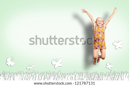 Girl jumping in a color dress on paint wall. collage of a happy childhood
