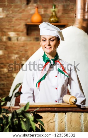 portrait of a cook, is on the traditional kitchen