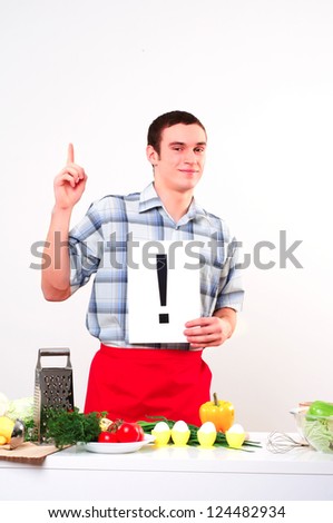 Chef holding a plate with an inscription exclamation mark
