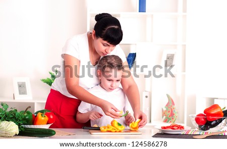 mother and daughter in the kitchen cooking