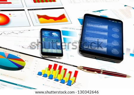 tablet, cell phone and financial documents, still life showing modern technologies in business