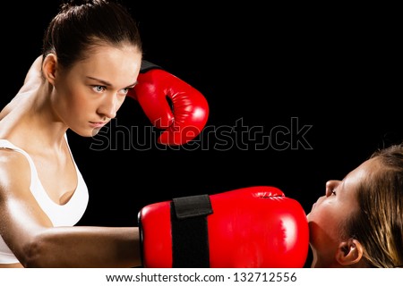 Aggressive boxing woman, hits an opponent in the head