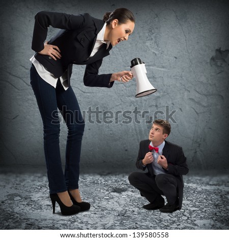 woman screams at the frightened man, the concept of aggression