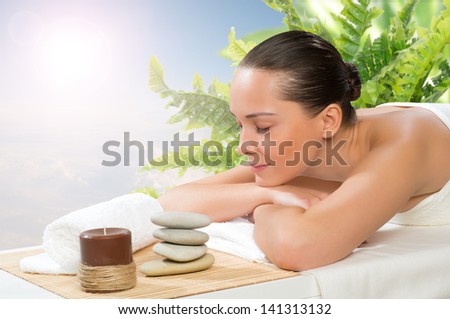 beautiful spa woman lying on the couch, gets pleasure