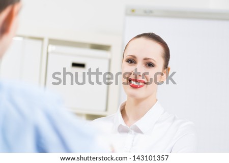 business woman holding an interview with a man in the office