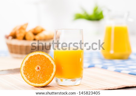 orange and a glass of orange juice, still life