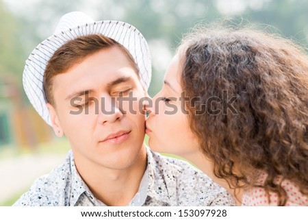 girl kissing a man on the cheek, spending time with loved ones