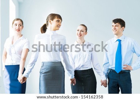 leadership team, a group of business people standing in a number of hand-in-hand, the leader stepped forward