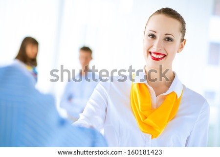 Business woman shaking hands and smiling colleague