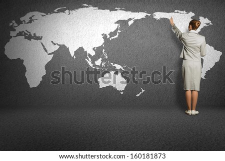 business woman draw a map on the wall, a global business