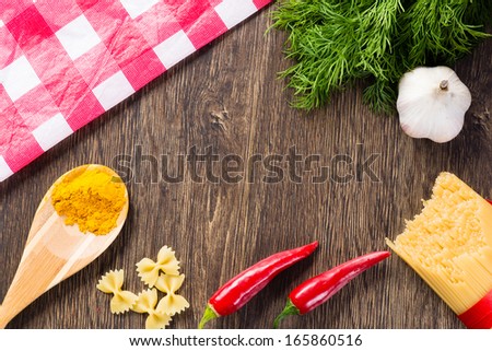 spices, dill, garlic, and chili paste on a wooden table top