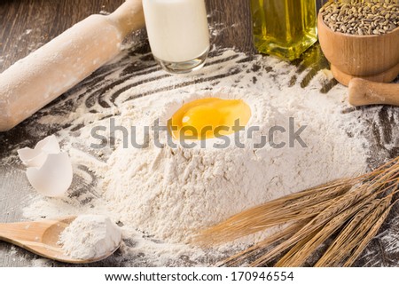 flour, eggs, white bread, wheat ears. still life
