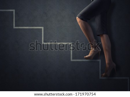 business woman legs drawn up the stairs, concept of success in business