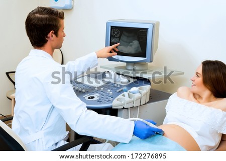 young pregnant woman on the ultrasound, health check