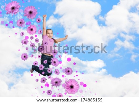 girl jumping on a background of blue sky and flowers