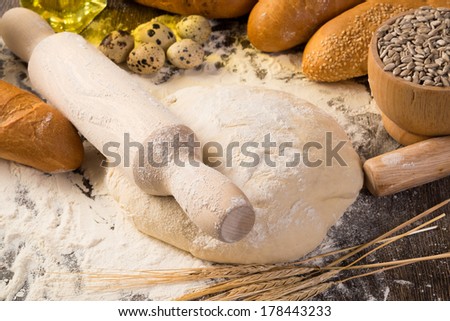 flour, eggs, white bread, wheat ears. still life