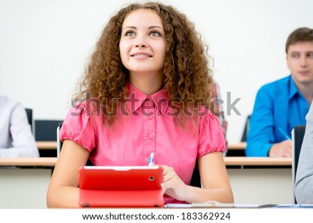 image of a young female student in the classroom, teaching at the University of