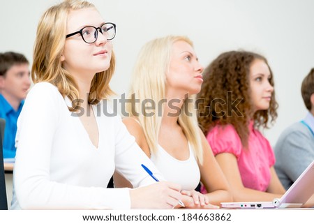 image of a young female students in the classroom, teaching at the University of